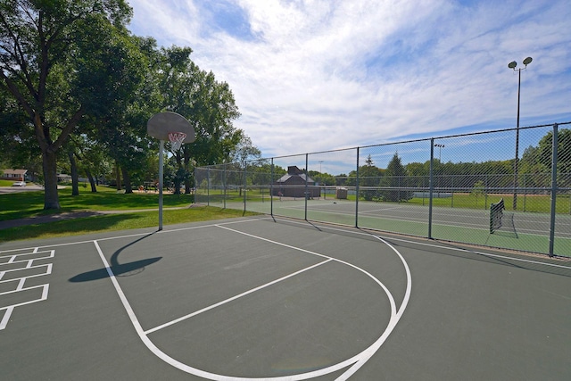 view of sport court featuring tennis court