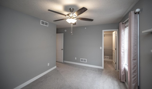 unfurnished bedroom featuring visible vents and carpet floors