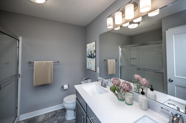 full bathroom with baseboards, toilet, a stall shower, and a textured ceiling