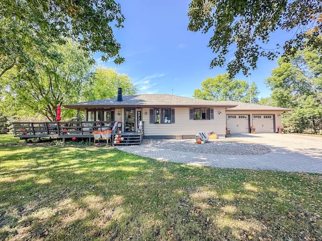 ranch-style house with a garage and a front lawn