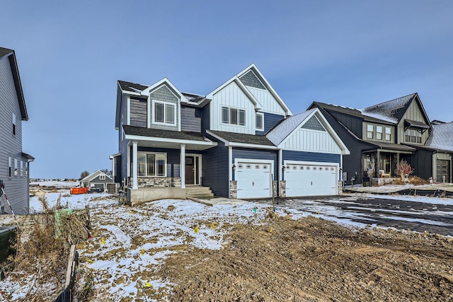 view of front of house with a garage and a porch