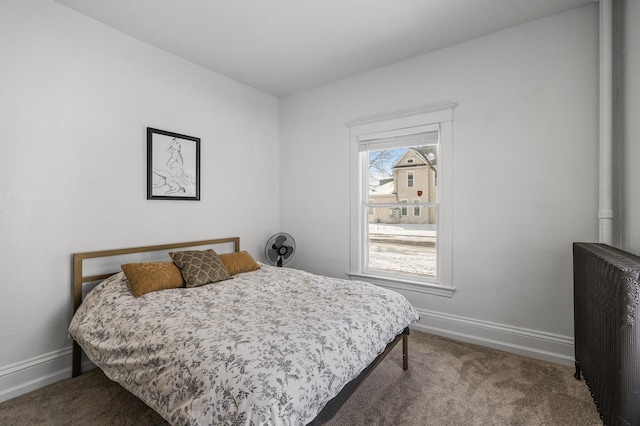 carpeted bedroom featuring radiator