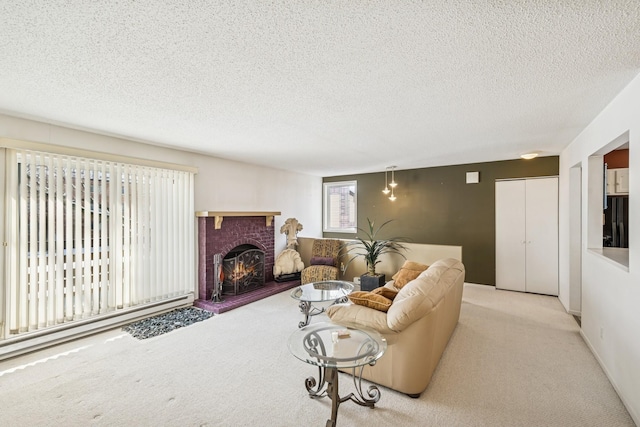 living room with a textured ceiling, a baseboard radiator, a fireplace, and carpet flooring