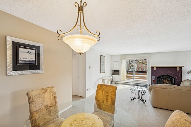 dining space featuring a brick fireplace, a textured ceiling, and baseboards