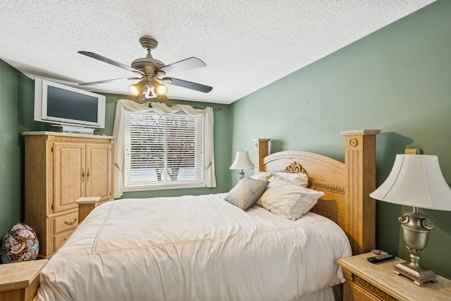 bedroom featuring a textured ceiling and ceiling fan