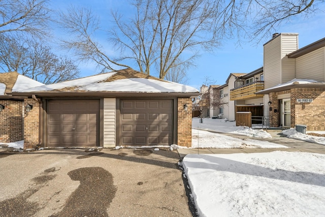 view of snow covered garage