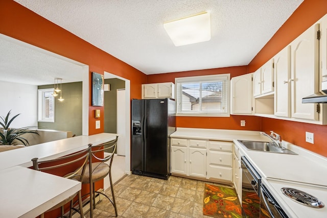 340 Ford Rd Unit 5, Saint Louis Park, MN 55426 - kitchen with black appliances, a sink, a textured ceiling, and white cabinetry
