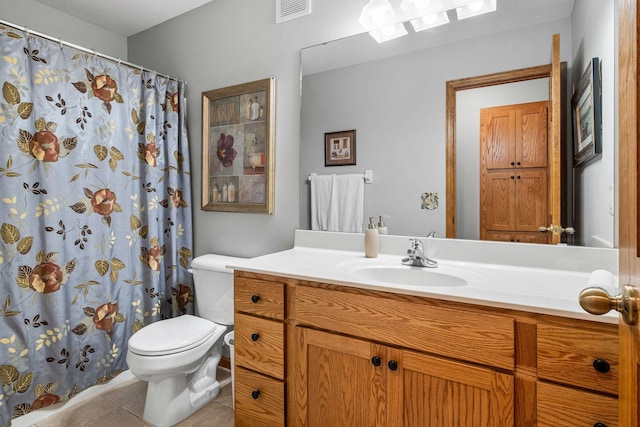 bathroom featuring a shower with curtain, vanity, tile patterned floors, and toilet