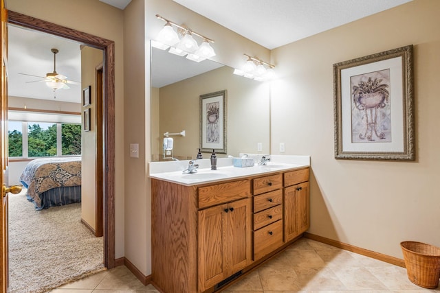 bathroom featuring ceiling fan, vanity, and tile patterned flooring