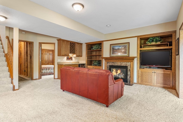 carpeted living room with built in shelves