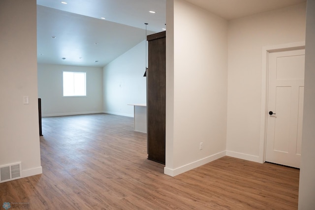 spare room with light hardwood / wood-style flooring