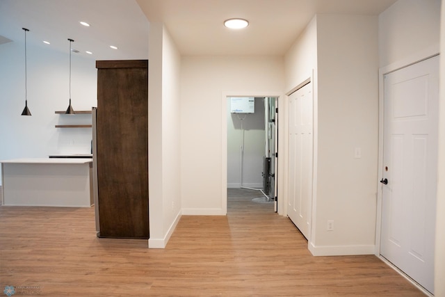 corridor featuring light hardwood / wood-style flooring