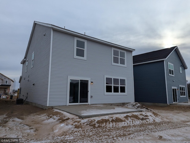 back of house featuring central AC unit