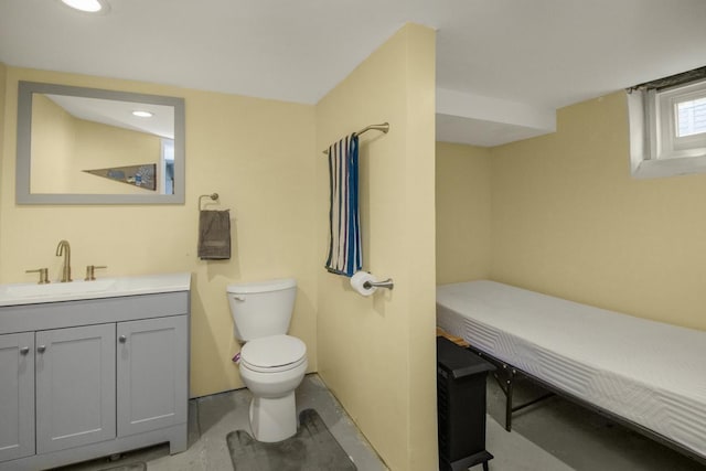 bathroom featuring toilet and vanity