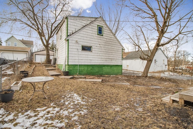 view of property exterior with an outbuilding