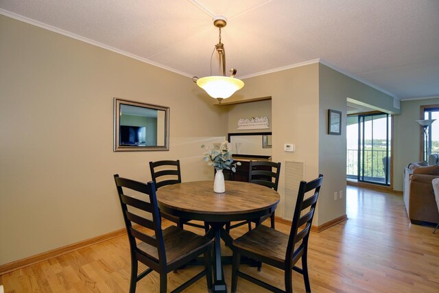 1077 Sibley Memorial Hwy Unit 607, Lilydale, MN 55118 - dining area with ornamental molding and light wood-type flooring