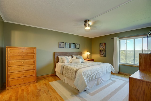 1077 Sibley Memorial Hwy Unit 607, Lilydale, MN 55118 - bedroom featuring ceiling fan, ornamental molding, a textured ceiling, and light wood-type flooring