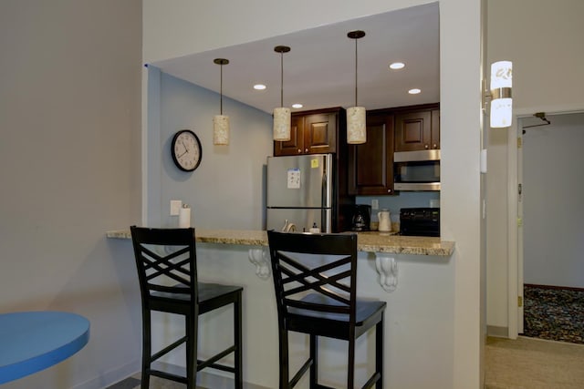 1077 Sibley Memorial Hwy Unit 607, Lilydale, MN 55118 - kitchen with pendant lighting, stainless steel appliances, a kitchen breakfast bar, light stone counters, and kitchen peninsula