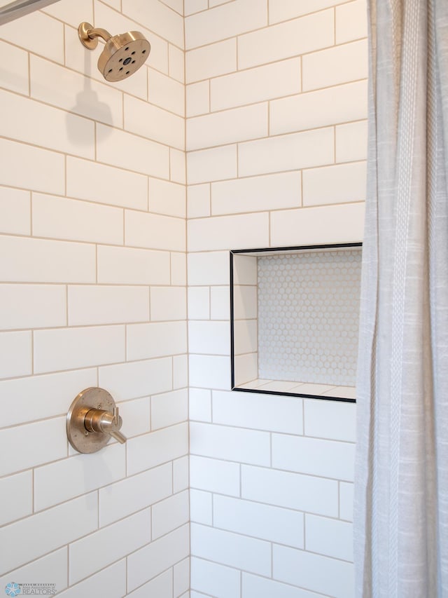 bathroom with curtained shower