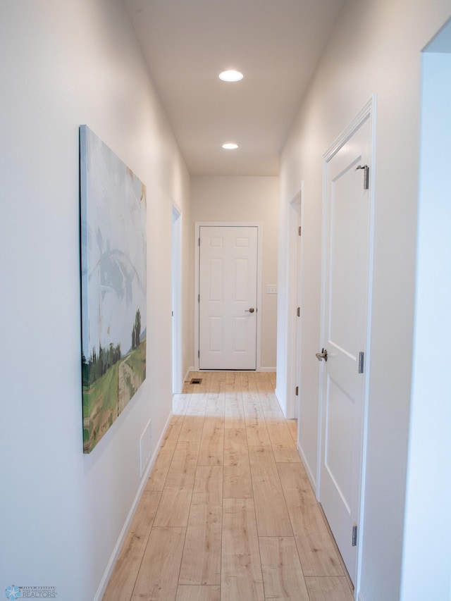 hallway featuring light wood-type flooring