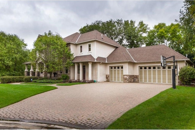 view of front of home featuring a garage and a front yard