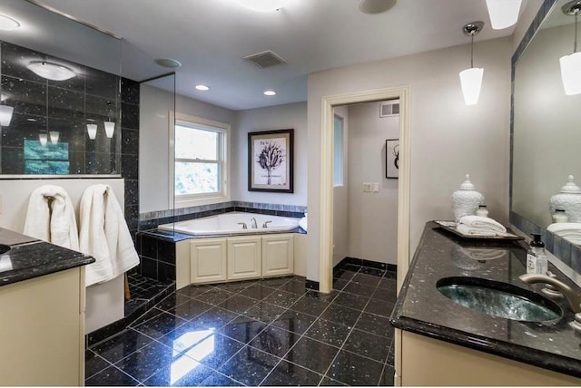 bathroom featuring vanity and separate shower and tub