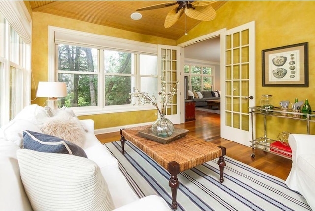 sunroom with french doors, ceiling fan, wood ceiling, and vaulted ceiling