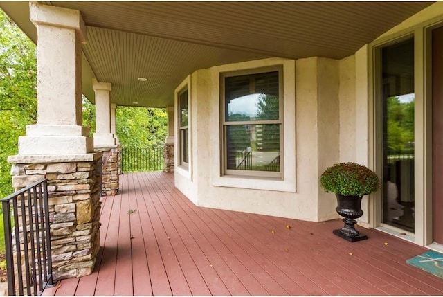 wooden terrace with a porch