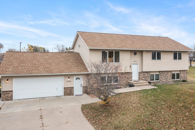 view of front of property with a garage and a front yard