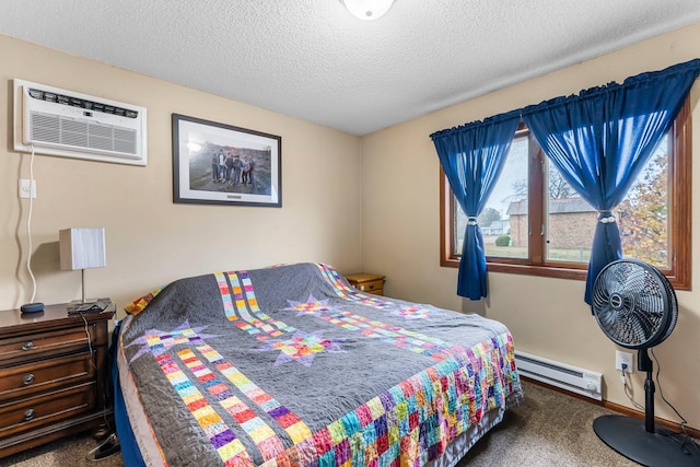 bedroom with a baseboard radiator, dark carpet, a textured ceiling, and an AC wall unit