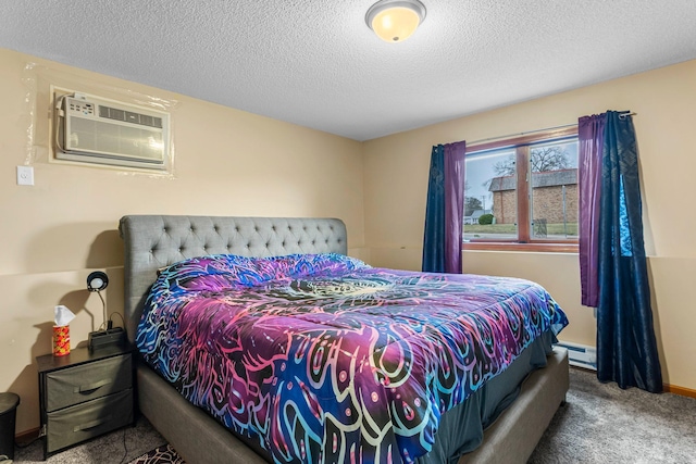 bedroom featuring a baseboard heating unit, a wall mounted air conditioner, a textured ceiling, and carpet flooring