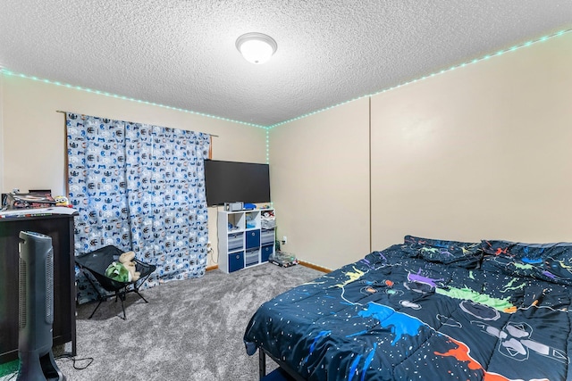 carpeted bedroom featuring a textured ceiling