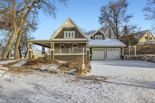 view of front of property featuring a porch and a garage