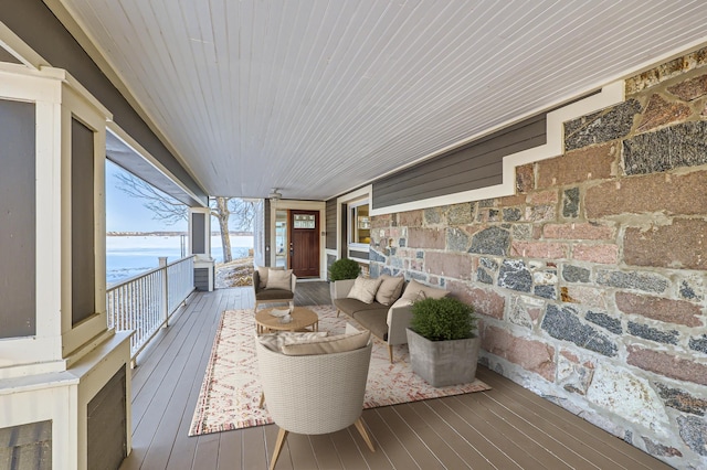 wooden deck featuring a water view