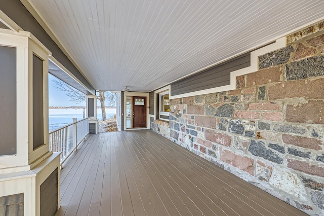 wooden deck featuring a water view