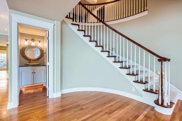 stairs featuring hardwood / wood-style floors