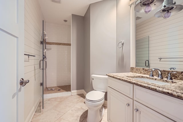 bathroom with walk in shower, vanity, and toilet