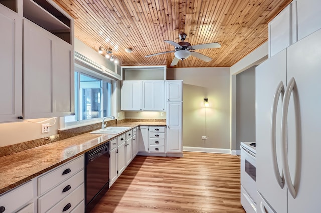 kitchen featuring white cabinetry, sink, white appliances, and light stone countertops