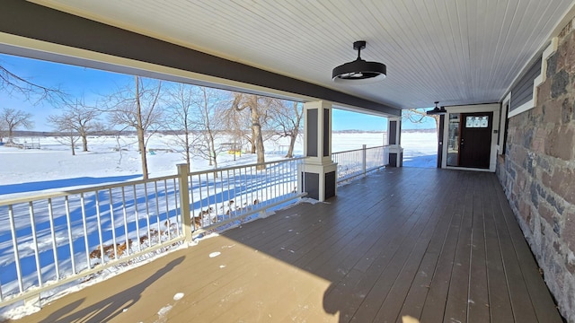 view of snow covered deck