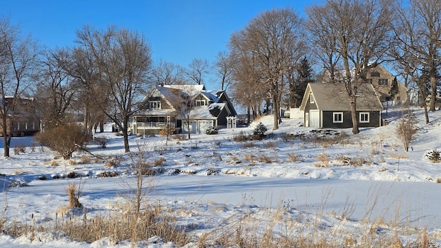 view of yard layered in snow