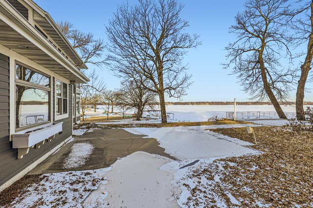 view of yard layered in snow