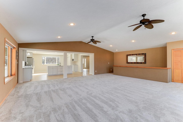 3571 Centerville Rd, Vadnais Heights, MN 55127 - unfurnished living room featuring ceiling fan, light carpet, vaulted ceiling, recessed lighting, and baseboards
