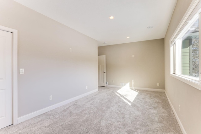 3571 Centerville Rd, Vadnais Heights, MN 55127 - empty room featuring light carpet, baseboards, and recessed lighting