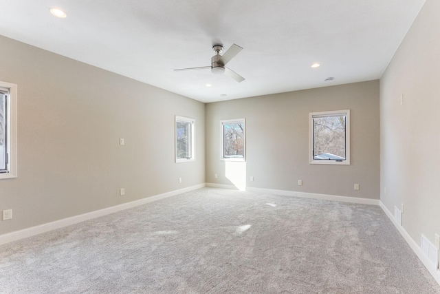 3571 Centerville Rd, Vadnais Heights, MN 55127 - empty room featuring healthy amount of natural light, ceiling fan, light colored carpet, recessed lighting, and baseboards