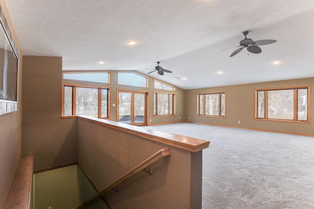 3571 Centerville Rd, Vadnais Heights, MN 55127 - carpeted spare room featuring ceiling fan, lofted ceiling, baseboards, recessed lighting, and a textured ceiling