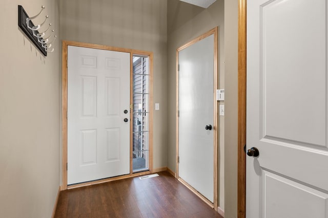 foyer entrance featuring dark hardwood / wood-style floors