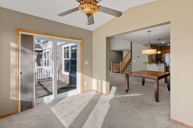 game room featuring lofted ceiling, light colored carpet, and ceiling fan