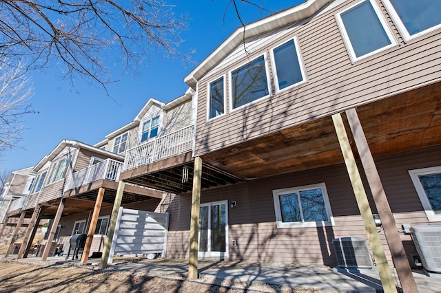 rear view of property with central air condition unit