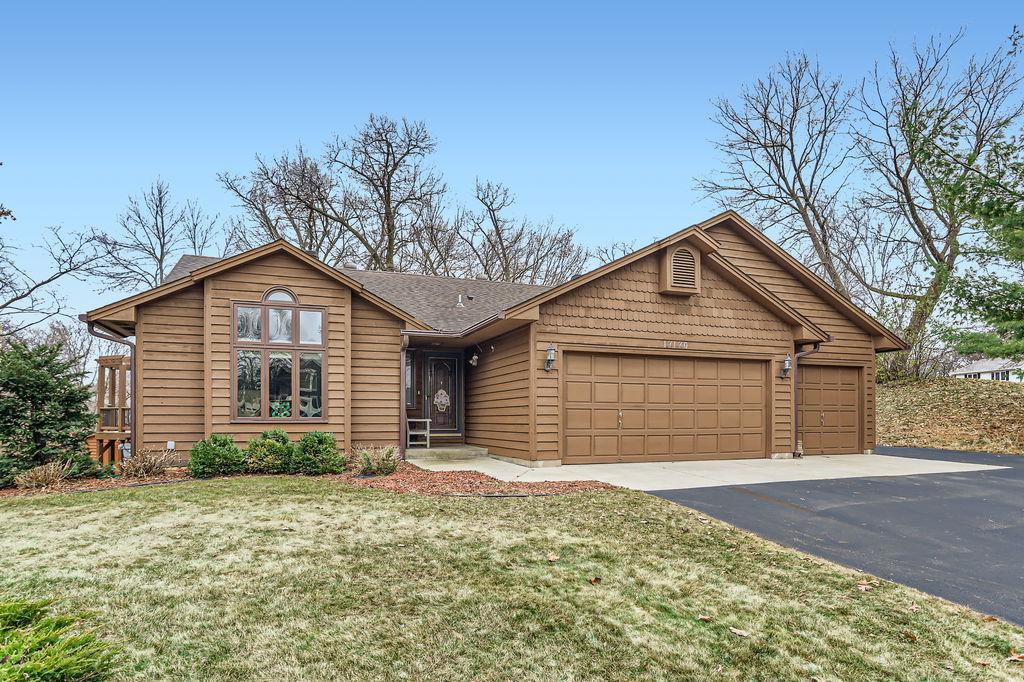 view of front facade with a garage and a front lawn