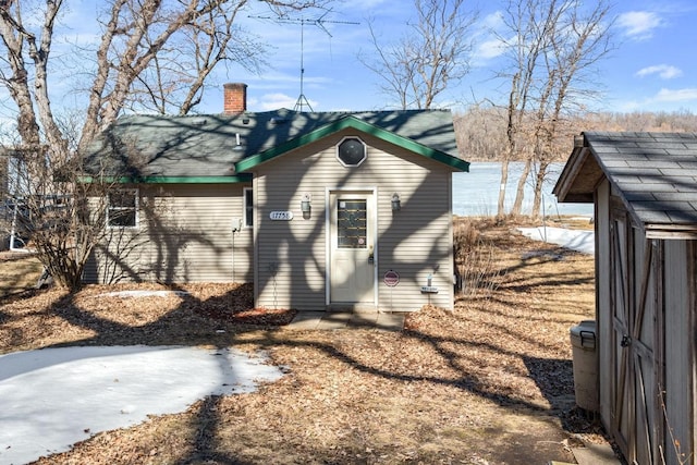 view of home's exterior with a chimney